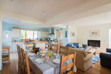 The spacious open plan kitchen/dining-room has space for everyone for cooking, eating and relaxing and a handy shower-room in the corner too.