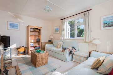 The sitting-room to the front of the house is a light and comfortable space.