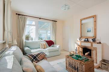 The sitting-room has an open fire to keep you cosy on those cooler days.