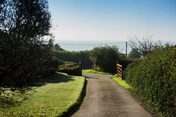 The private driveway leading back to the lane and the beach beyond.
