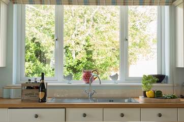 The kitchen overlooks the rear garden.