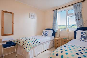 Bedroom 2 has the master bedroom on one side and the bathroom and cloakroom on the other.