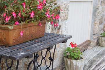 The decking-area is adorned with flowers in summer.