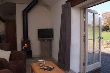 The sitting-area over looks the terrace and the meadow.