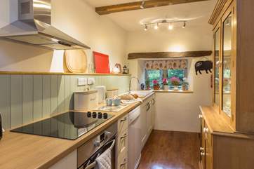 Step down to the galley style kitchen which is really well-equipped.