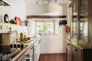Step down to the galley style kitchen which is really well-equipped.