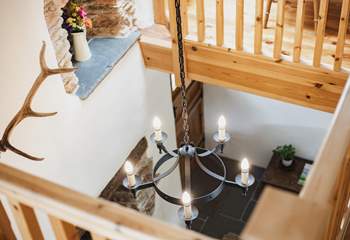Having this mezzanine level means that the wonderful warmth of the wood-burning stove fills the cottage.