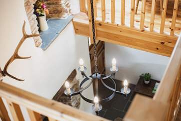 Having this mezzanine level means that the wonderful warmth of the wood-burning stove fills the cottage.