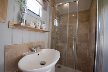 The en suite shower-room is beautifully fitted.