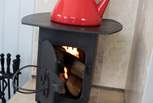 The cosy little wood-burner will keep you warm on cooler days (logs are inclusive).
