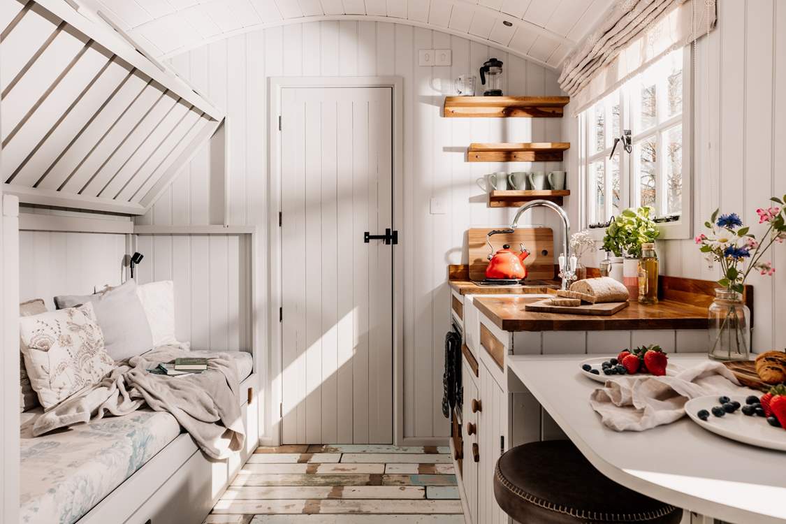The top bunk-bed folds up, creating extra living space during the day.