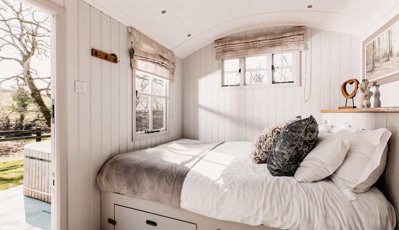 The sumptuous king-size bed is snuggled to the left of the hideaway.