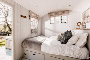 The sumptuous king-size bed is snuggled to the left of the hideaway.