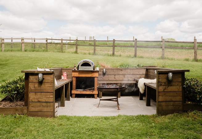 The snug fire-pit and pizza oven area is a magical feature.