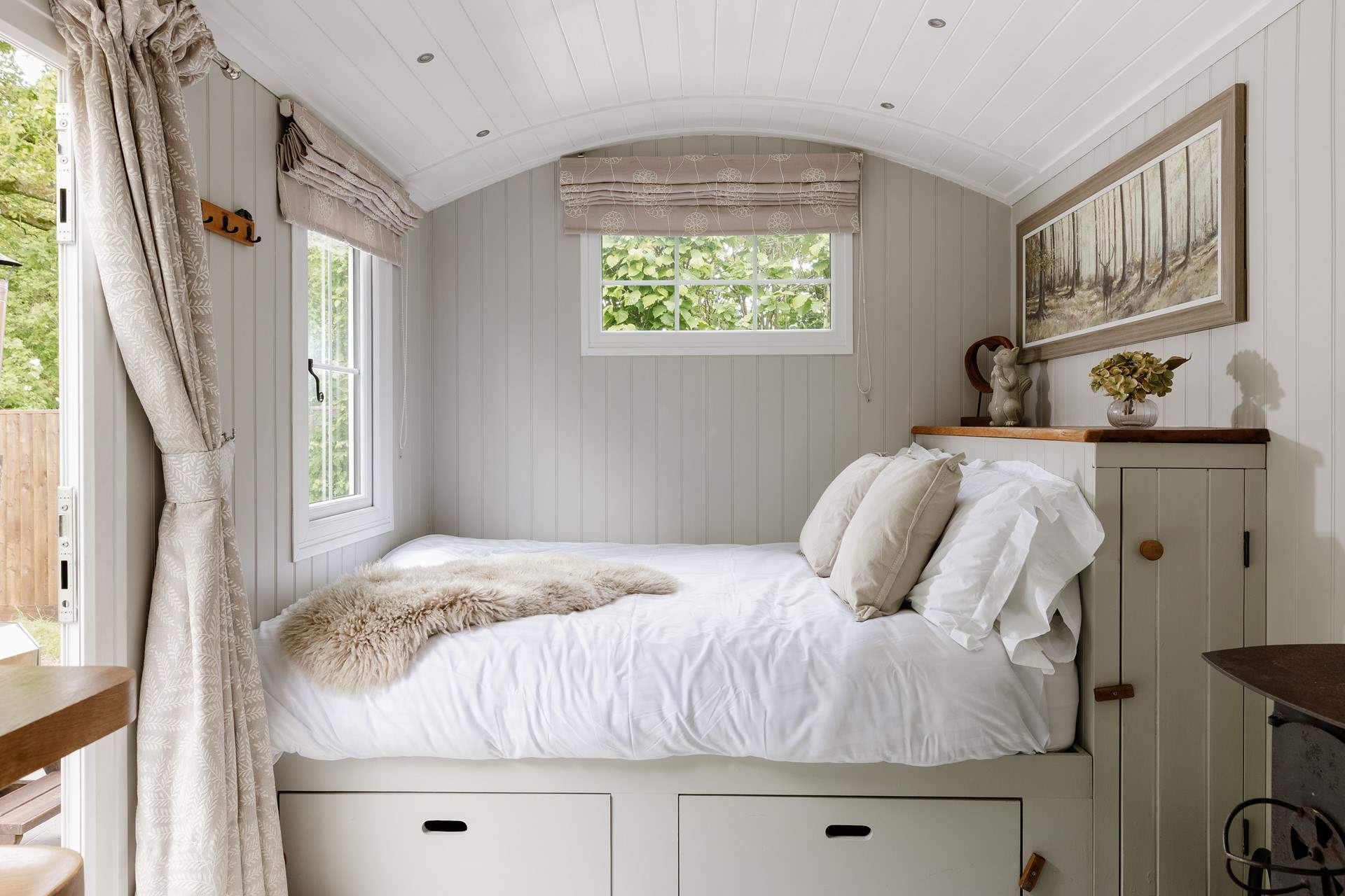 The sumptuous king-size bed is snuggled to the left of the hideaway.