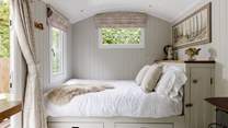 The sumptuous king-size bed is snuggled to the left of the hideaway.