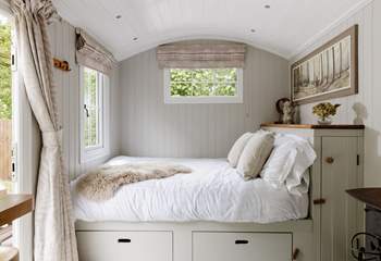 The sumptuous king-size bed is snuggled to the left of the hideaway.