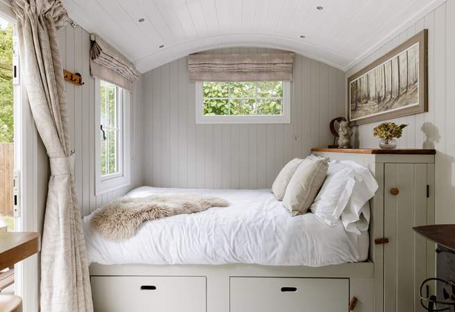 The sumptuous king-size bed is snuggled to the left of the hideaway.