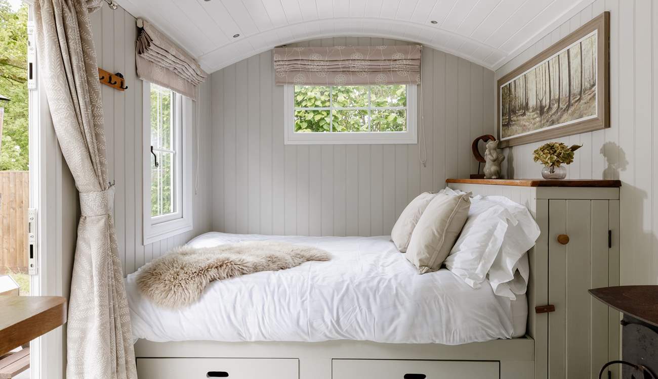 The sumptuous king-size bed is snuggled to the left of the hideaway.