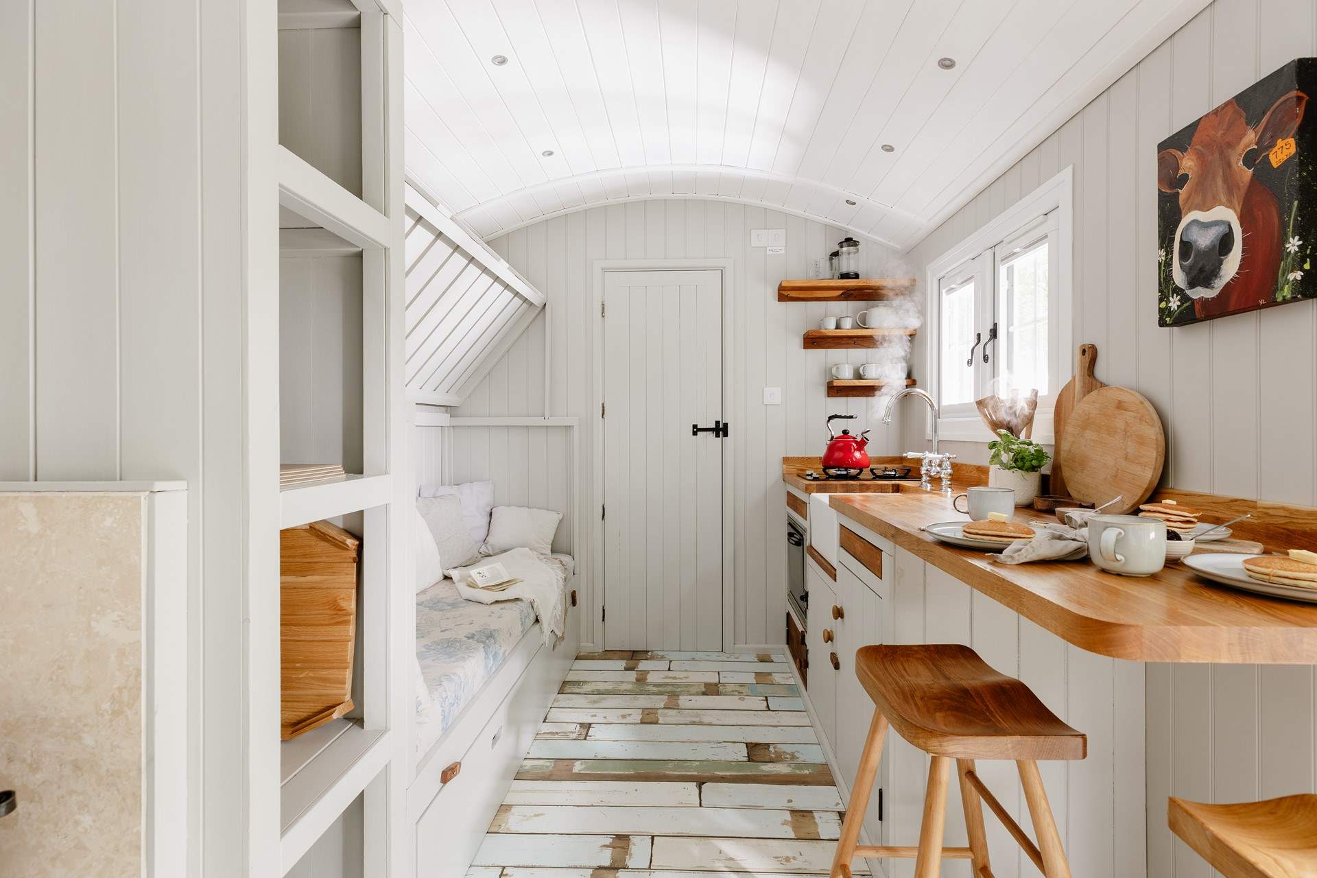 The top bunk-bed folds up, creating extra living space during the day.