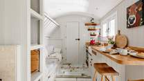 The top bunk-bed folds up, creating extra living space during the day.