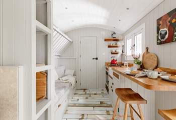 The top bunk-bed folds up, creating extra living space during the day.