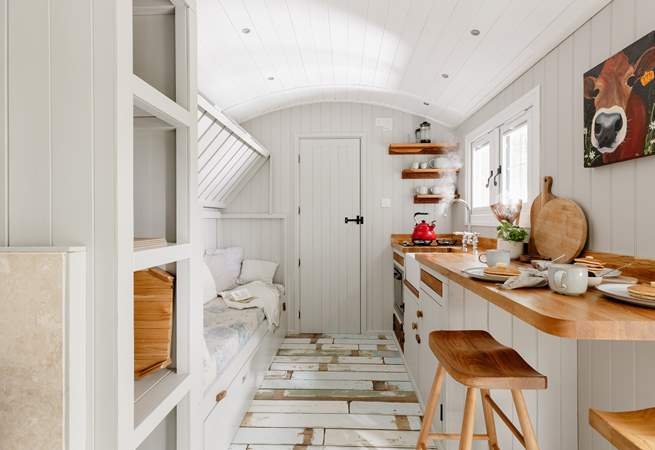 The top bunk-bed folds up, creating extra living space during the day.