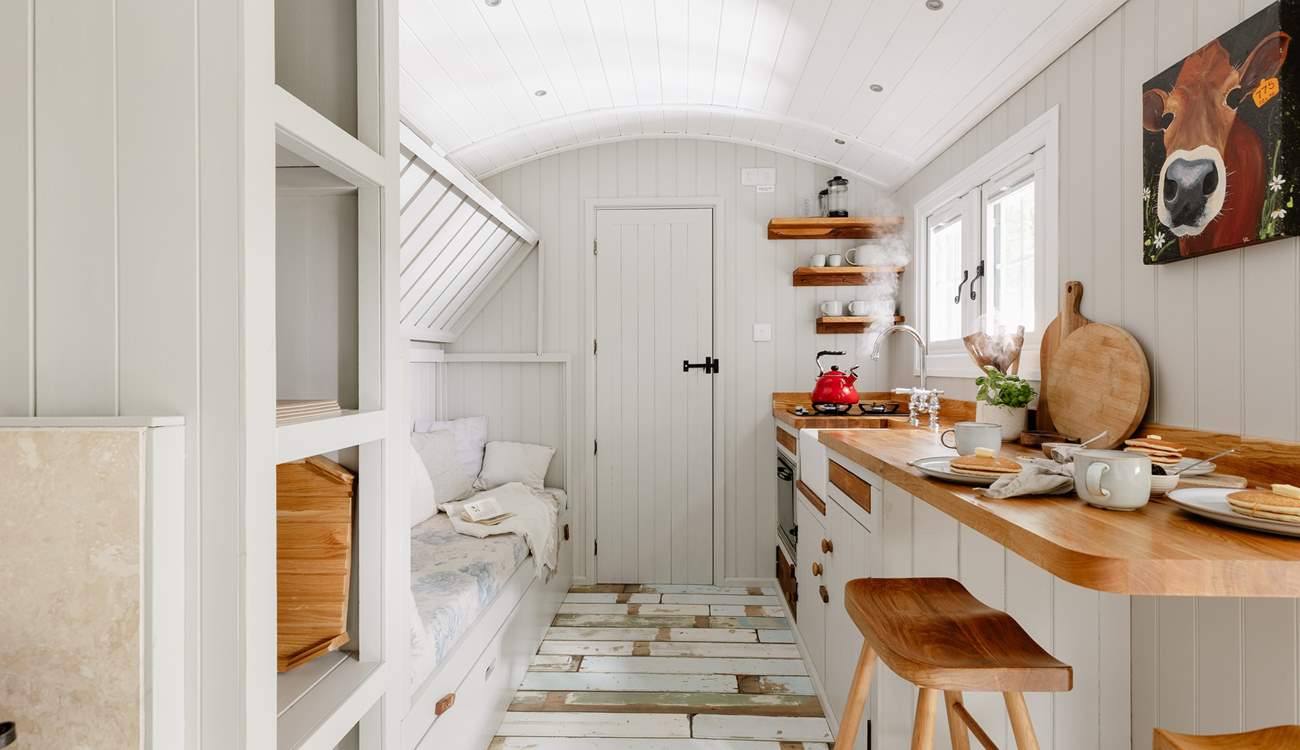The top bunk-bed folds up, creating extra living space during the day.