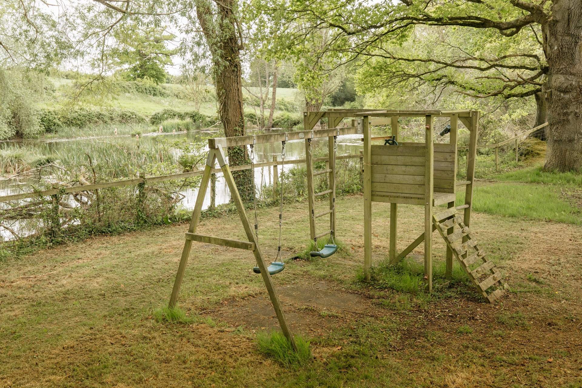 A short walk away, children can enjoy the swings by the lake.