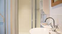 The shower-room has a large cubicle and heated towel rail for warm towels.