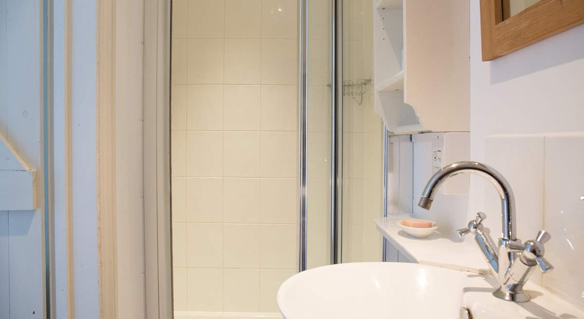 The shower-room has a large cubicle and heated towel rail for warm towels.