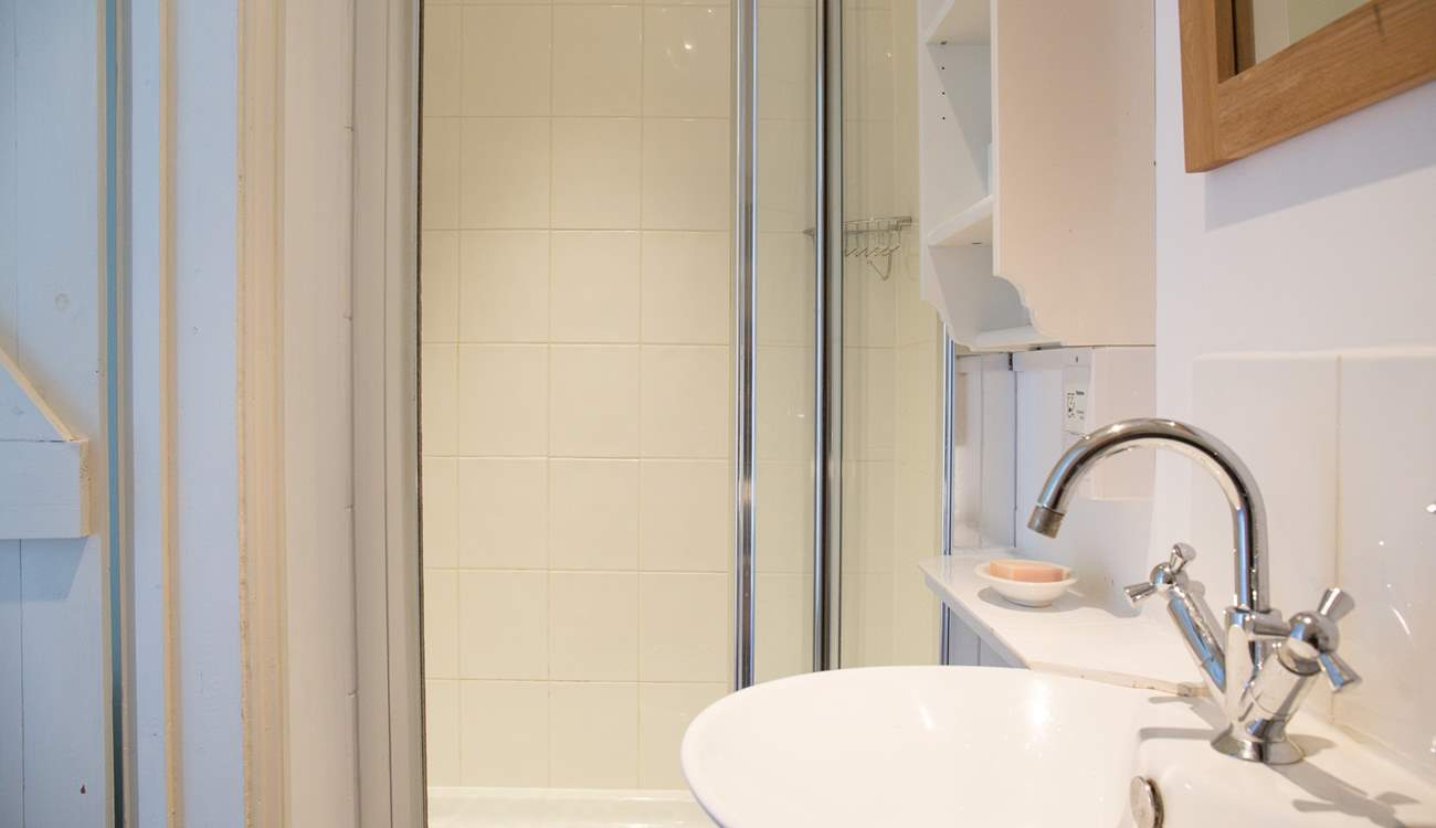 The shower-room has a large cubicle and heated towel rail for warm towels.