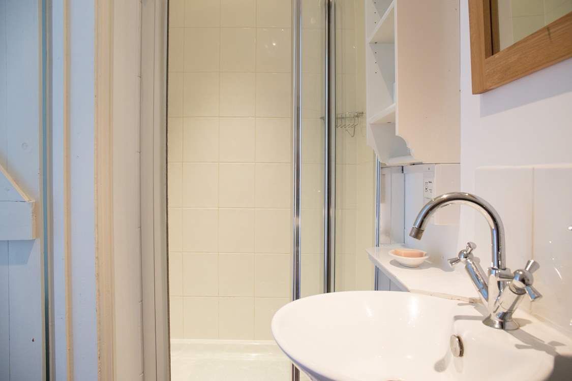 The shower-room has a large cubicle and heated towel rail for warm towels.