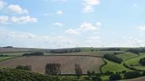 Rural Dorset from Maiden Castle, just outside of Dorchester, one of the largest Iron Age hill forts in Europe.