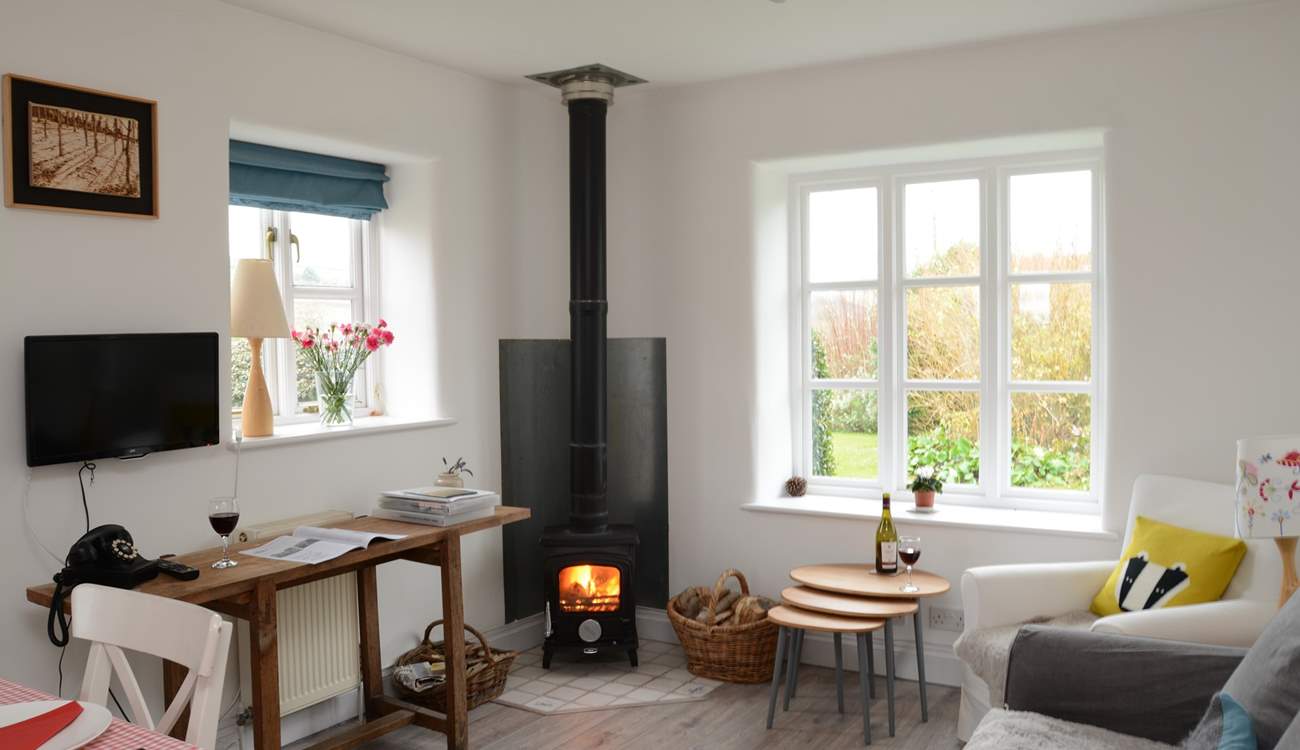 The kitchen/dining/sitting-room is the perfect place to relax after a day of exploring, with its cosy wood-burner.