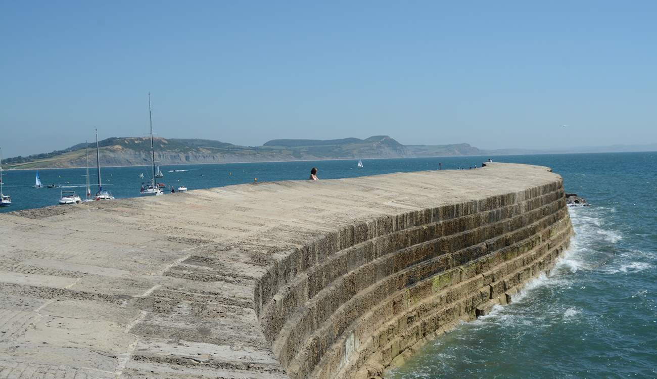 The iconic Cobb at Lyme Regis with Golden Cap in the background.