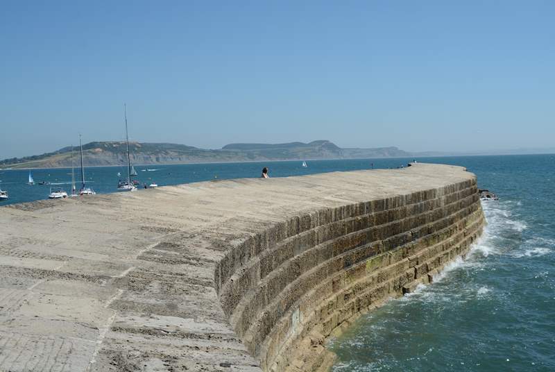 The iconic Cobb at Lyme Regis with Golden Cap in the background.