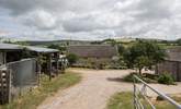 This delighful farmyard has far-reaching views, the helpful owners live in the farmhouse in the middle  of the photo. - Thumbnail Image