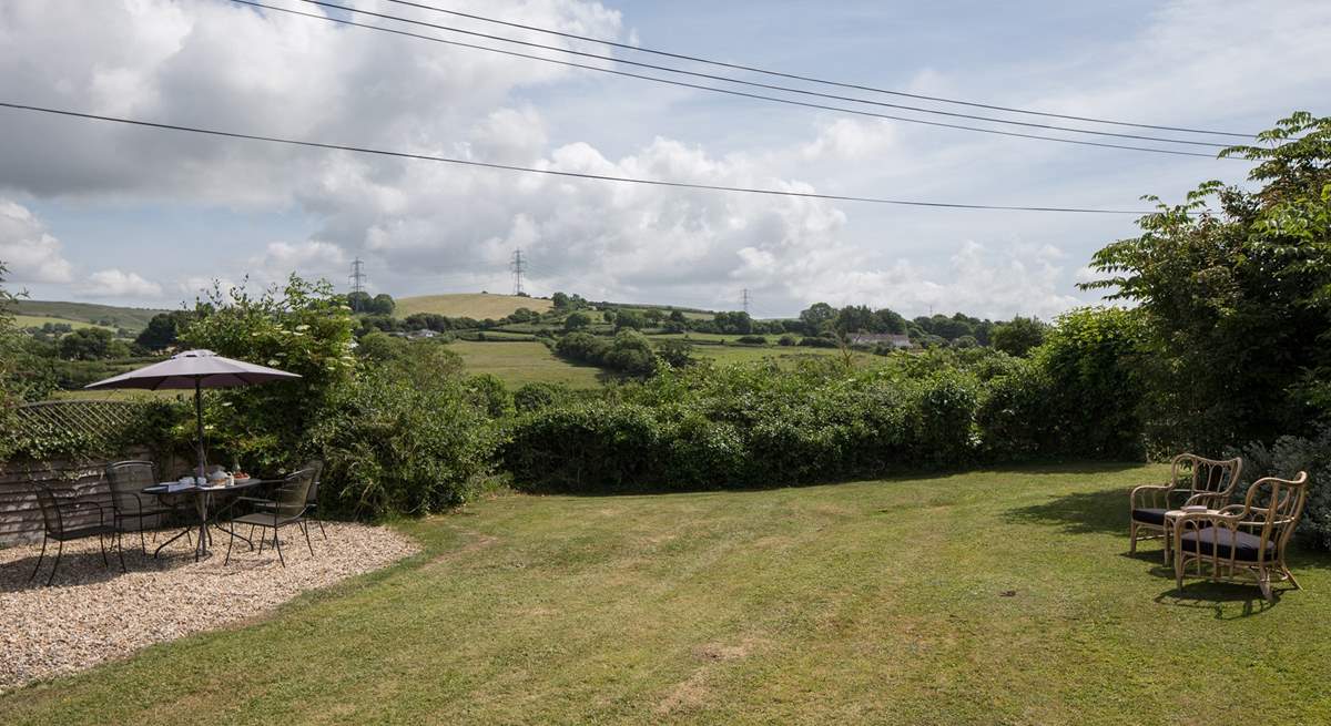 The mature garden, a perfect place to relax and enjoy the country air, maybe even a snooze.