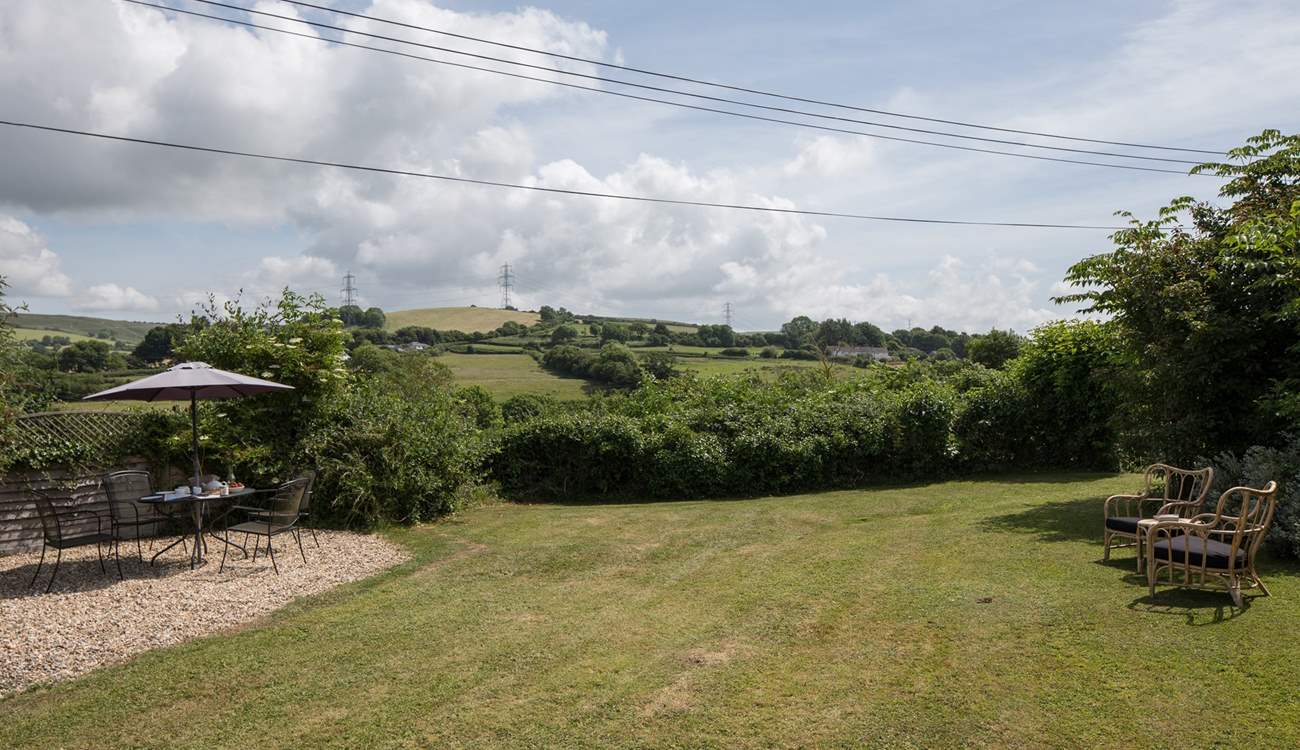 The mature garden, a perfect place to relax and enjoy the country air, maybe even a snooze.
