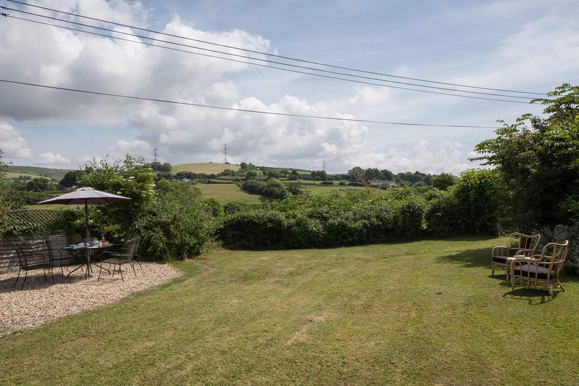 The mature garden, a perfect place to relax and enjoy the country air, maybe even a snooze.