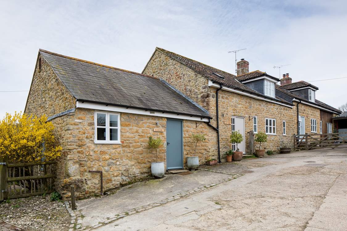 Badgers cottage is next door to Barn Owls cottage, Badgers is in the foreground.