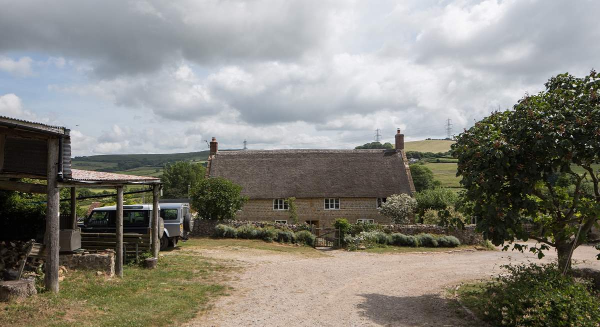 Looking down through the farmyard, the owners' house is at the bottom and the cottages to the right of the photo.