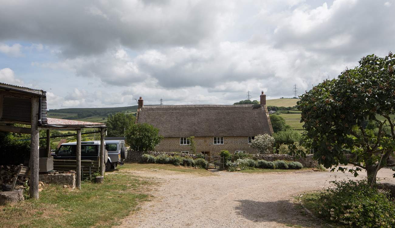 Looking down through the farmyard, the owners' house is at the bottom and the cottages to the right of the photo.