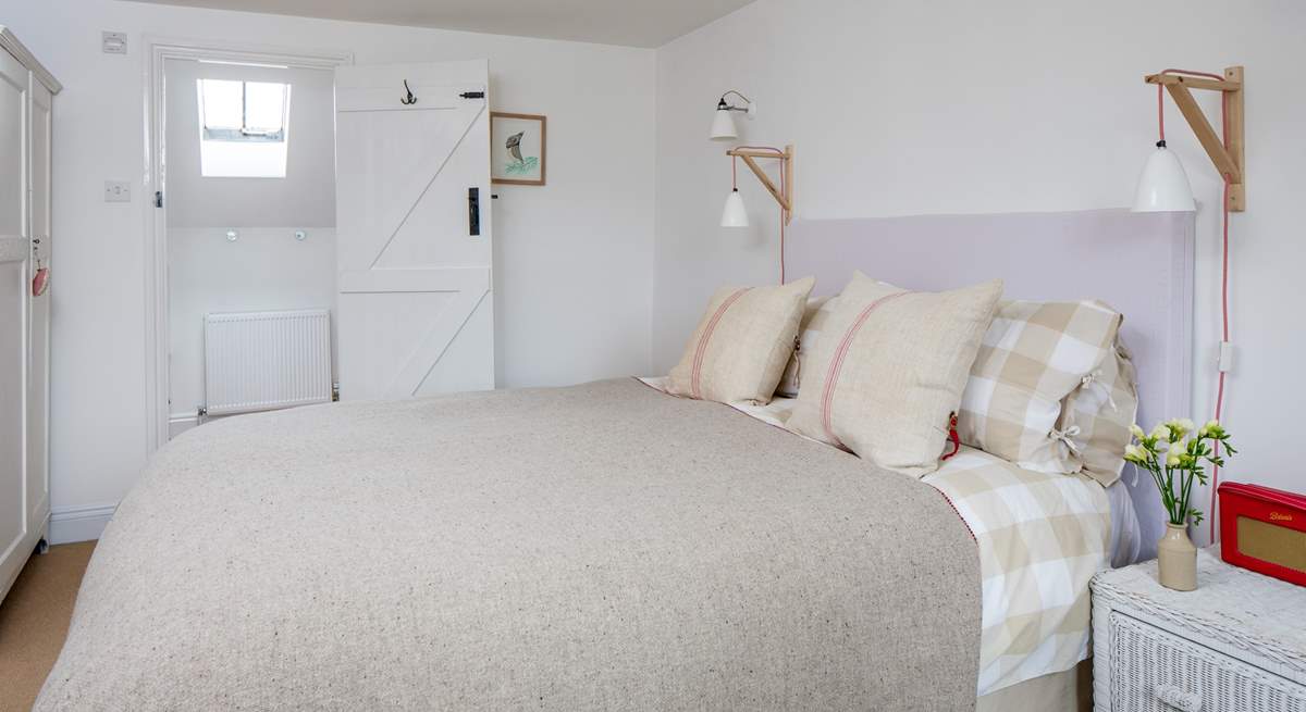 The master bedroom has a super comfy king-size double bed and an en suite bathroom.