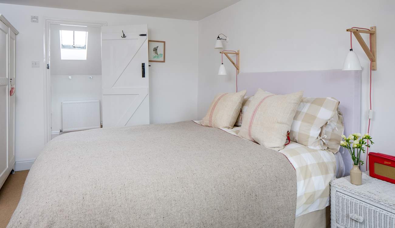 The master bedroom has a super comfy king-size double bed and an en suite bathroom.