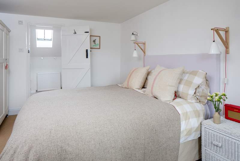 The master bedroom has a super comfy king-size double bed and an en suite bathroom.