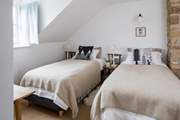 Bedroom 2 has a 'zip and link' (super-king or twin) bed. Please beware of the sloping ceiling.