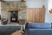 The TV can be cleverly hidden behind bespoke wooden doors.