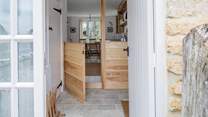 From the entrance hall, with the kitchen ahead and cloakroom to the left. Please mind the small step.